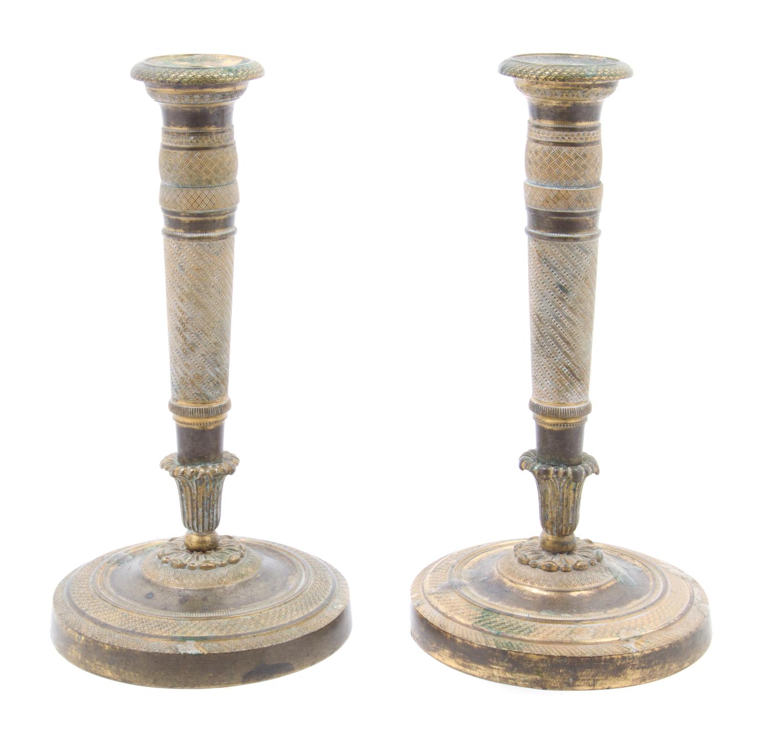A Pair of Empire Gilt Bronze Candlesticks Height 8 1/4 inches.