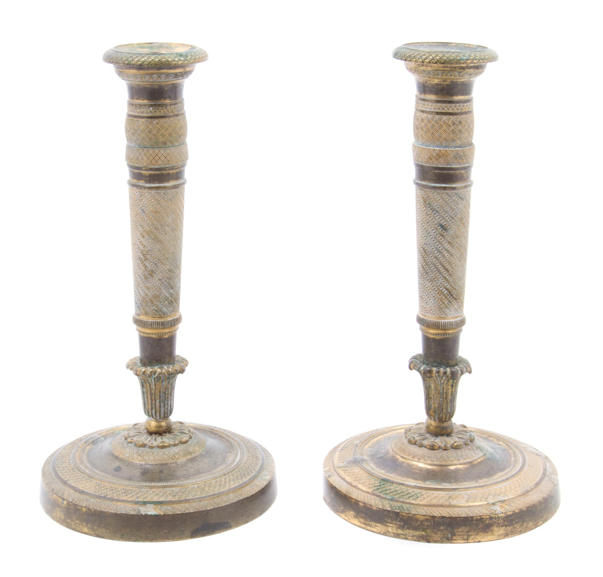 A Pair of Empire Gilt Bronze Candlesticks Height 8 1/4 inches.
