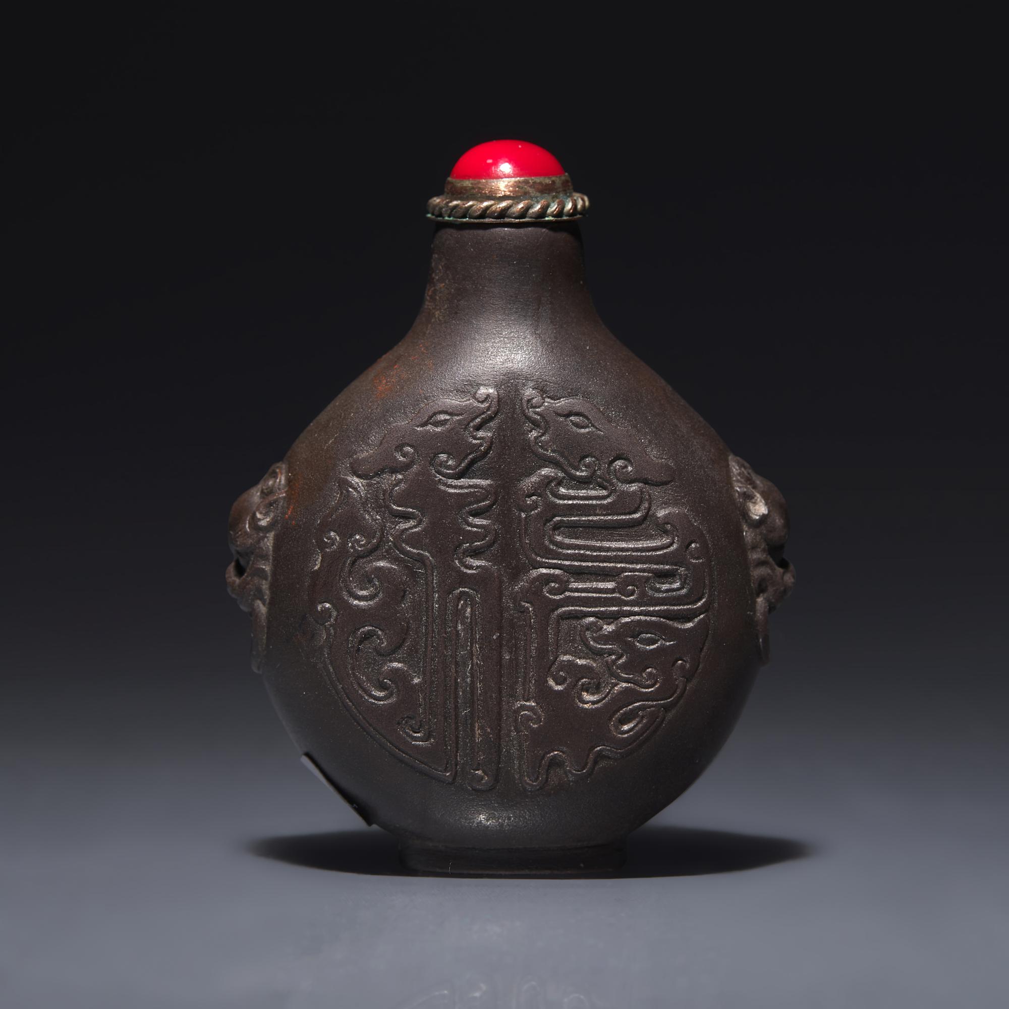 A Chinese Carved Duan Stone Snuff Bottle, Circa 1750-1820 1750-1820年 端石刻龍紋鼻烟壺