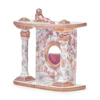A Staffordshire Pink Sunderland Lustreware Watch Hutch