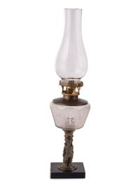 Four Gilt Metal and Glass Figural Oil Lamps