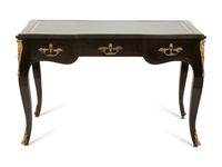 A Louis XV Style Gilt Metal-Mounted Ebonized Bureau Plat