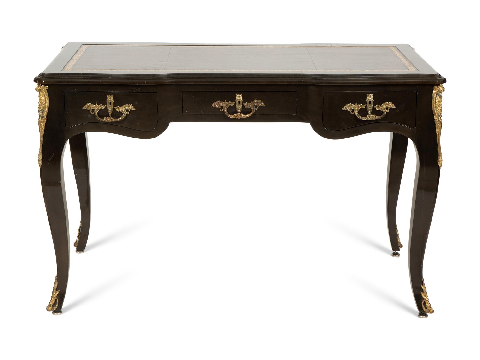 A Louis XV Style Gilt Metal-Mounted Ebonized Bureau Plat
