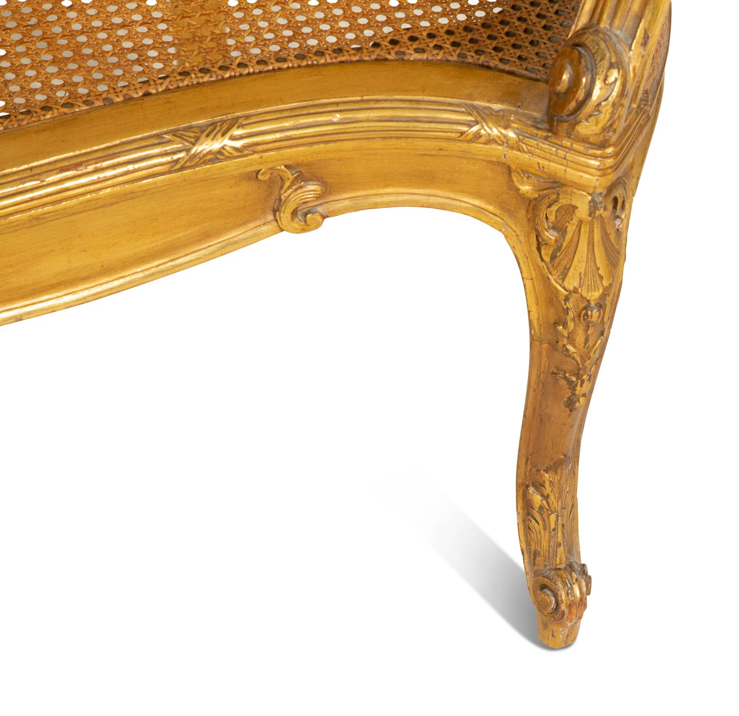 A Louis XV Style Caned Giltwood Settee