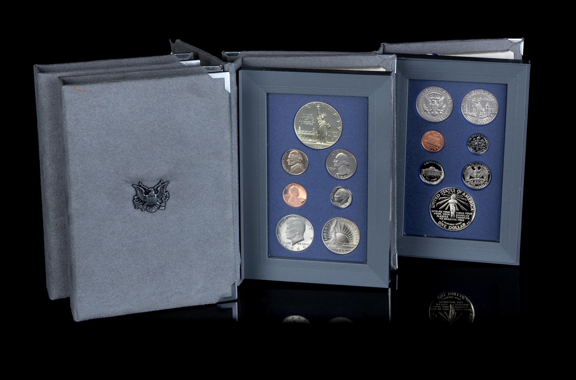 *A Group of Four United States 1986 Prestiege Seven-Coin Proof Set