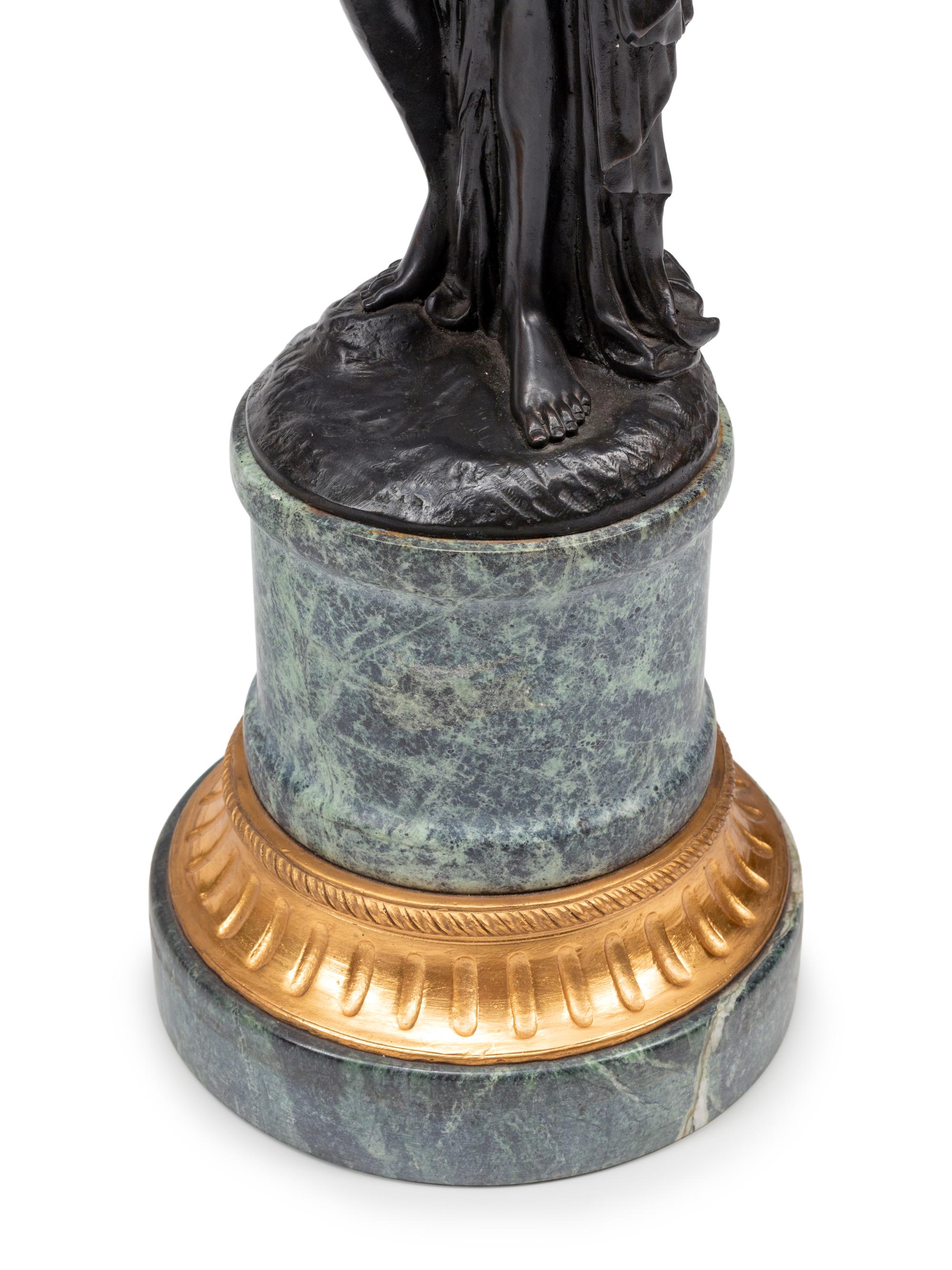 A Pair of French Gilt and Patinated Bronze and Marble Figural Three-Light Candelabra