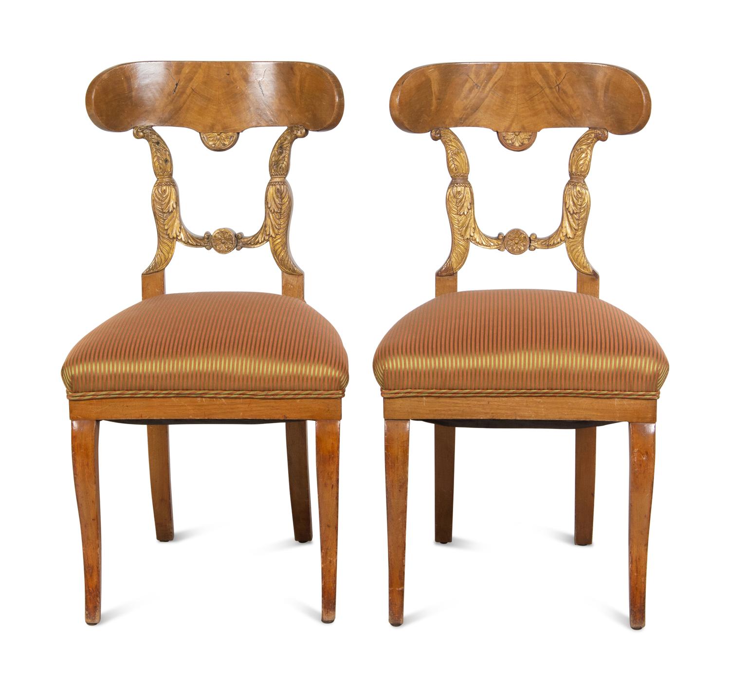 A Pair of Biedermeier Parcel-Gilt Birch Side Chairs