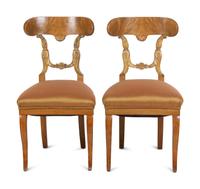 A Pair of Biedermeier Parcel-Gilt Birch Side Chairs
