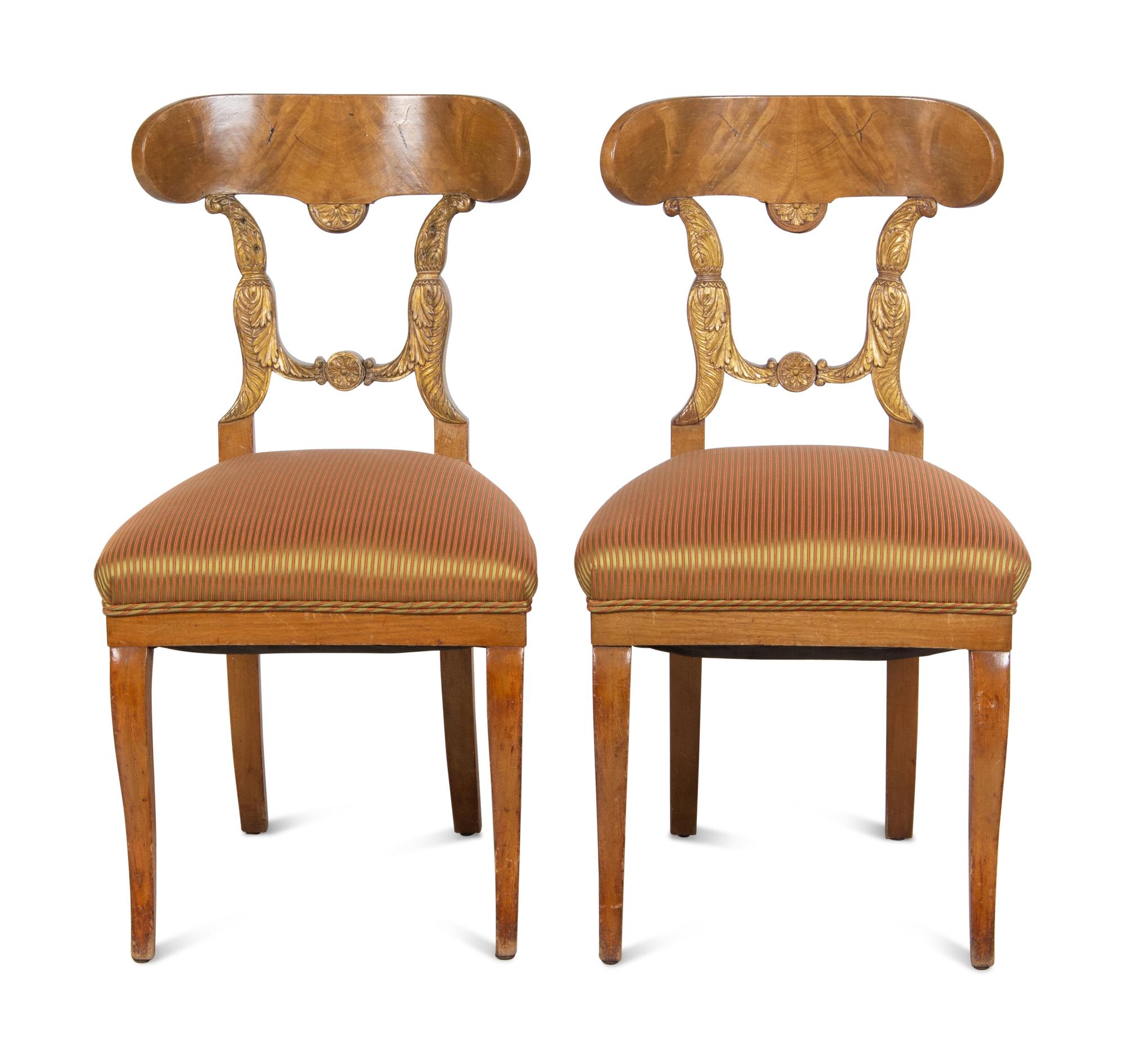 A Pair of Biedermeier Parcel-Gilt Birch Side Chairs