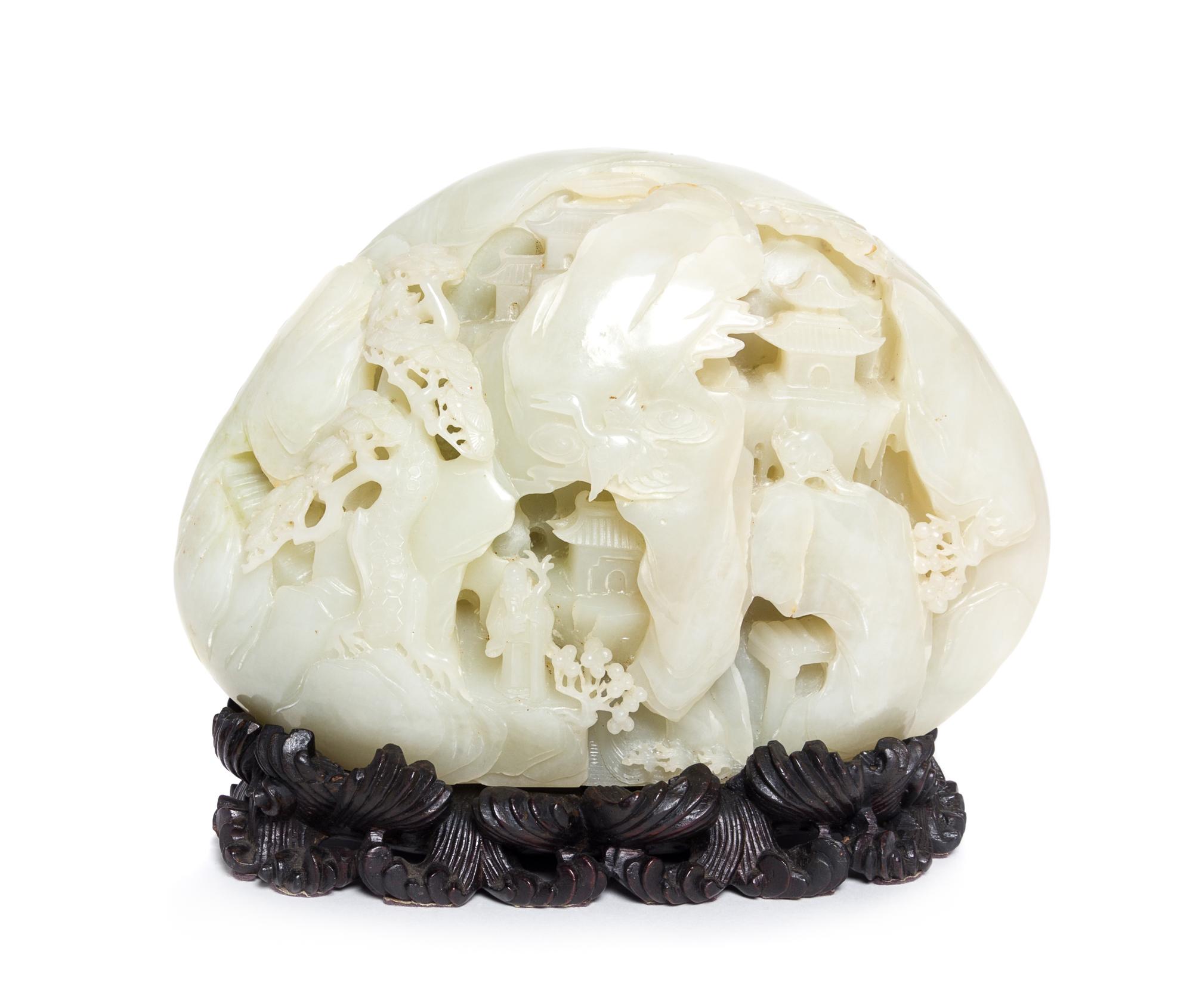 A Carved Pale Celadon Jade Boulder Height 7 x width 8 inches.