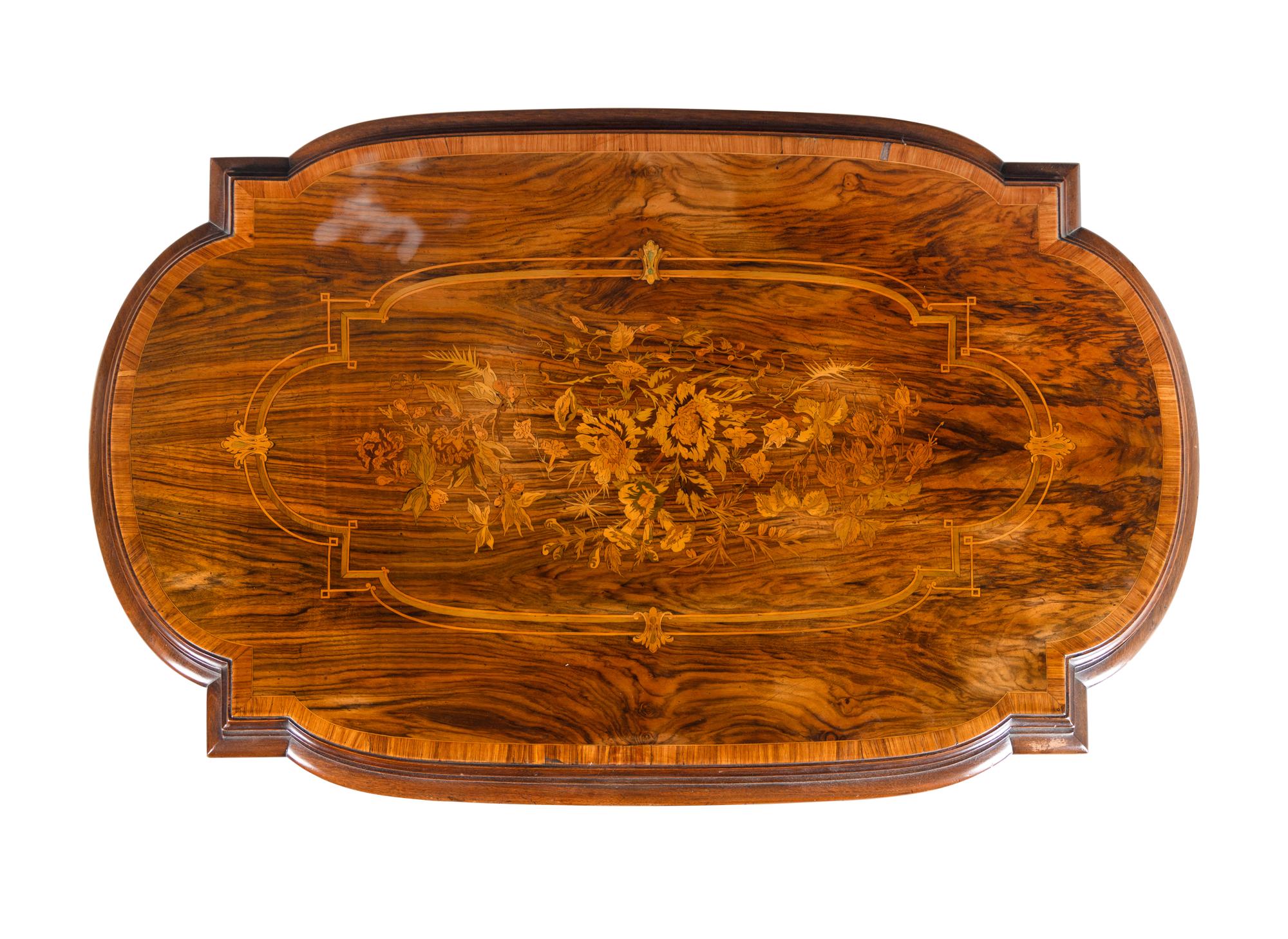 A Napoleon III Style Indian Rosewood and Marquetry Center Table