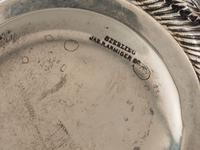 A Repousse Silver Three-Piece Tea Service