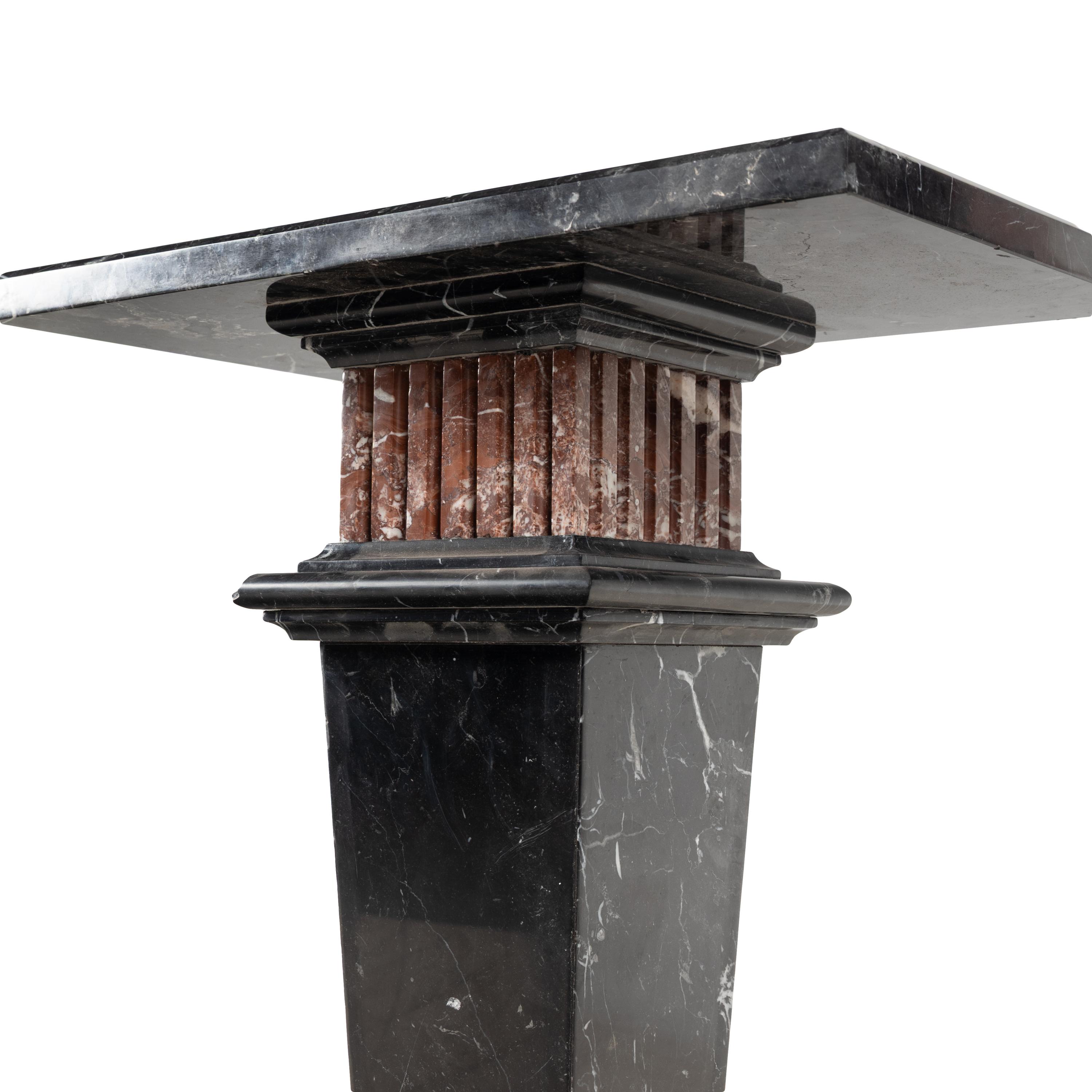 A Nero Marquina and Rosso Francia Marble Pedestal