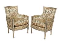 A Pair of Louis XVI Style Painted and Parcel Gilt Bergères