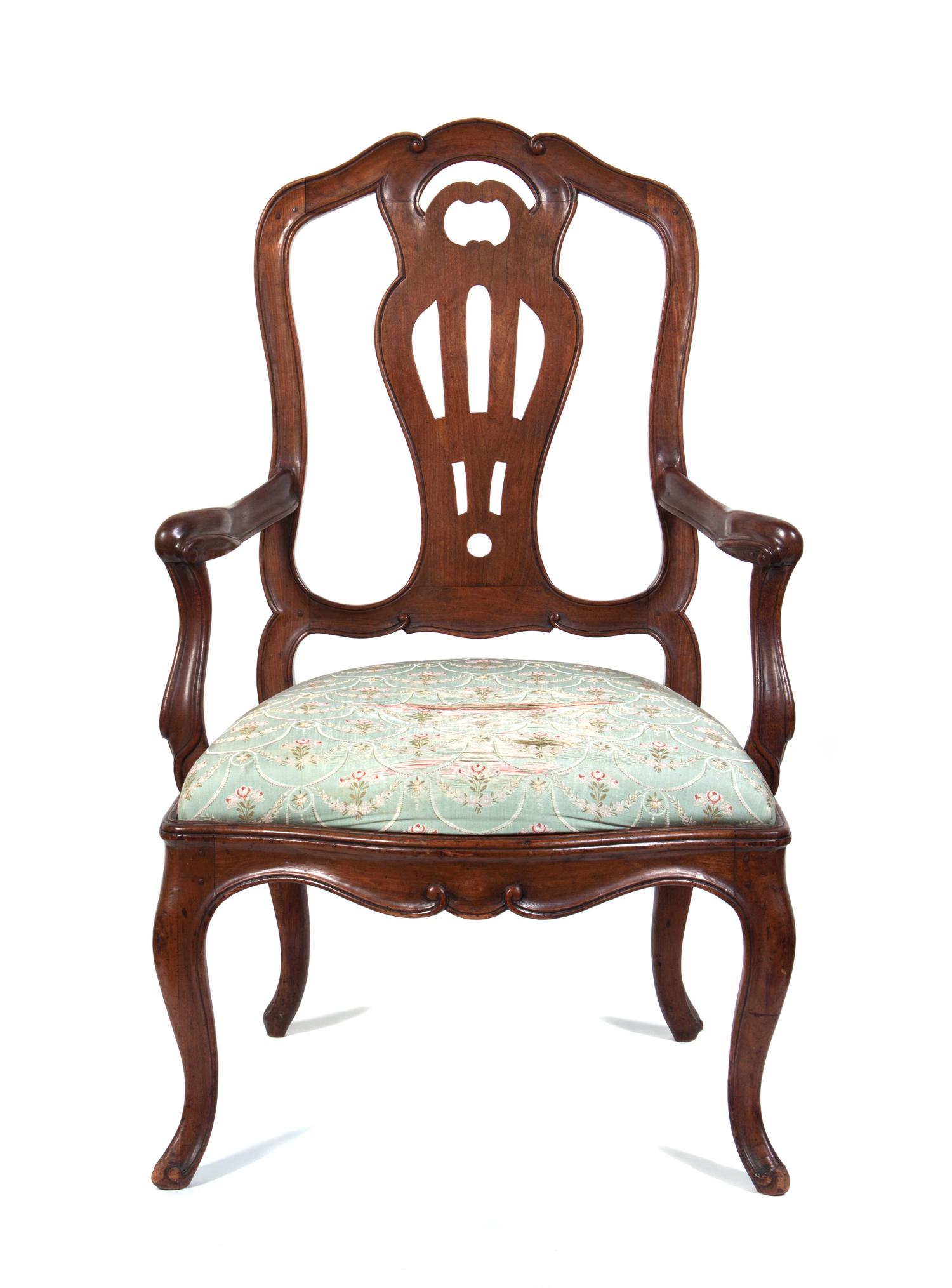 An Italian Walnut Armchair Height 41 3/4 inches.