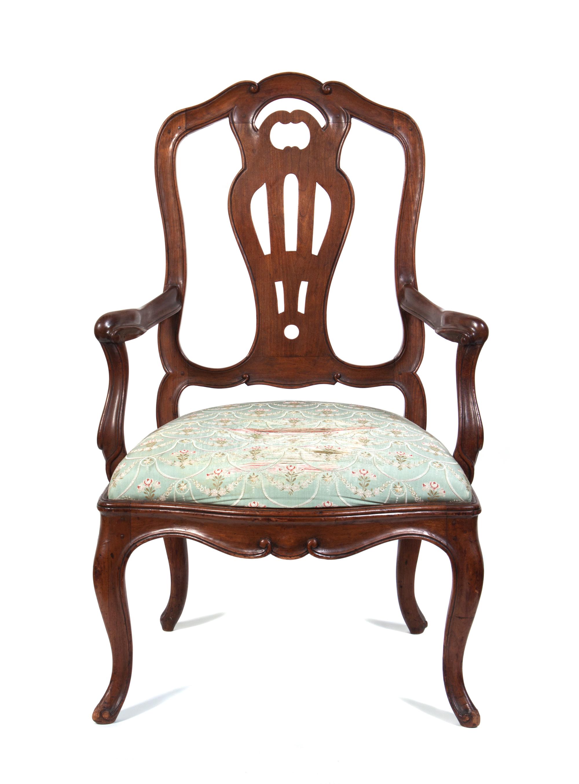 An Italian Walnut Armchair Height 41 3/4 inches.