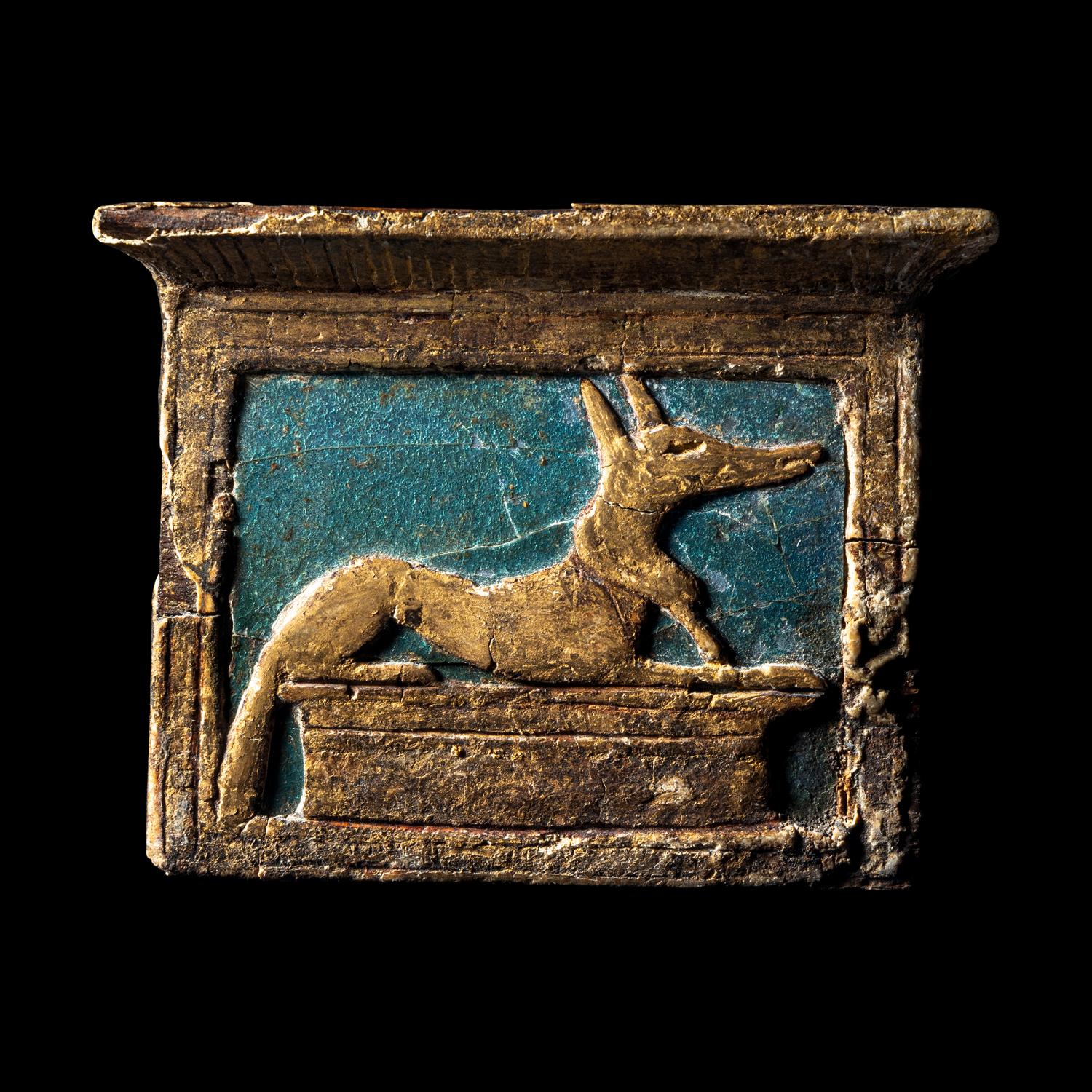 An Egyptian Enamel and Gilt Wood Anubis Pectoral
