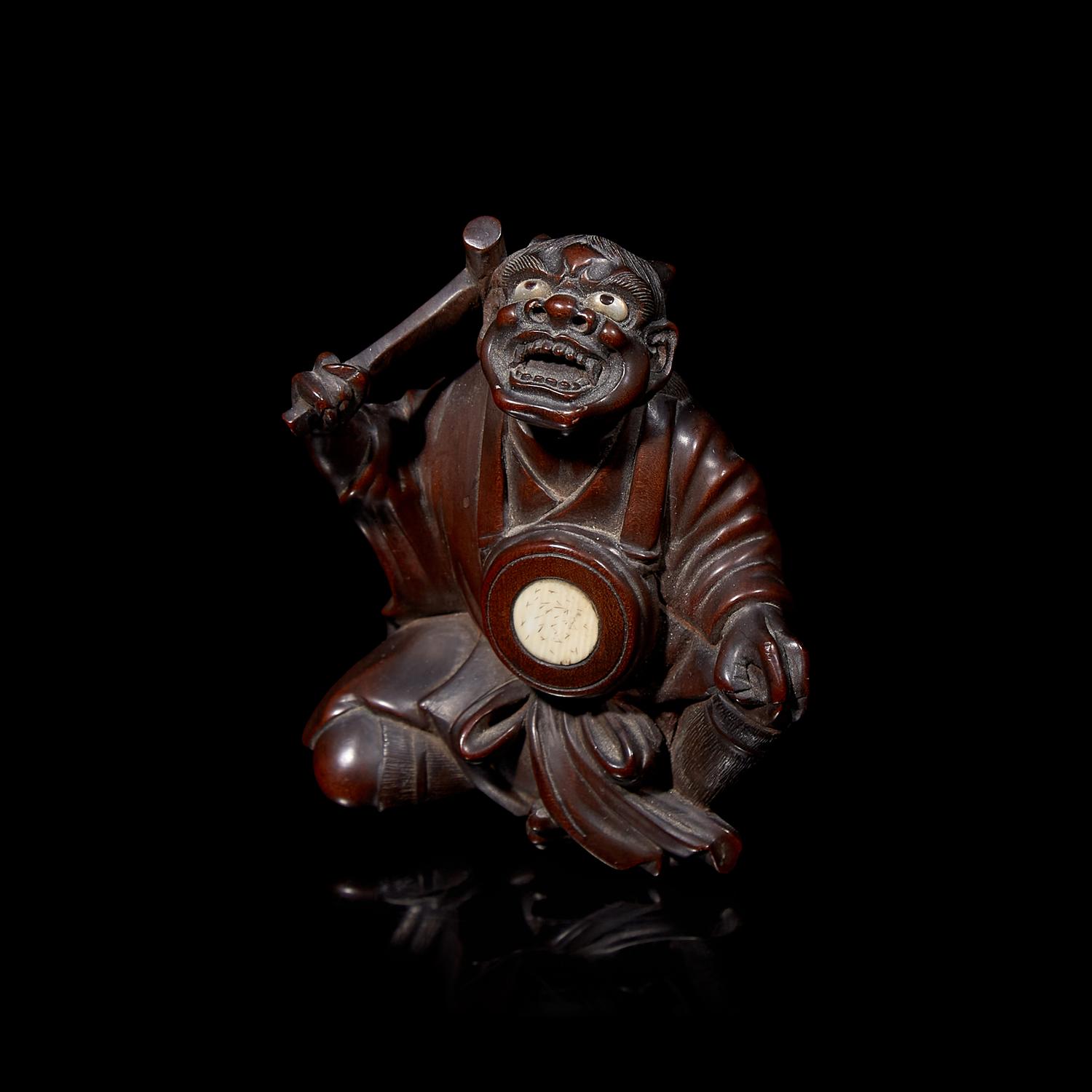 A Japanese Carved Boxwood "Oni" Okimono, Meiji Period