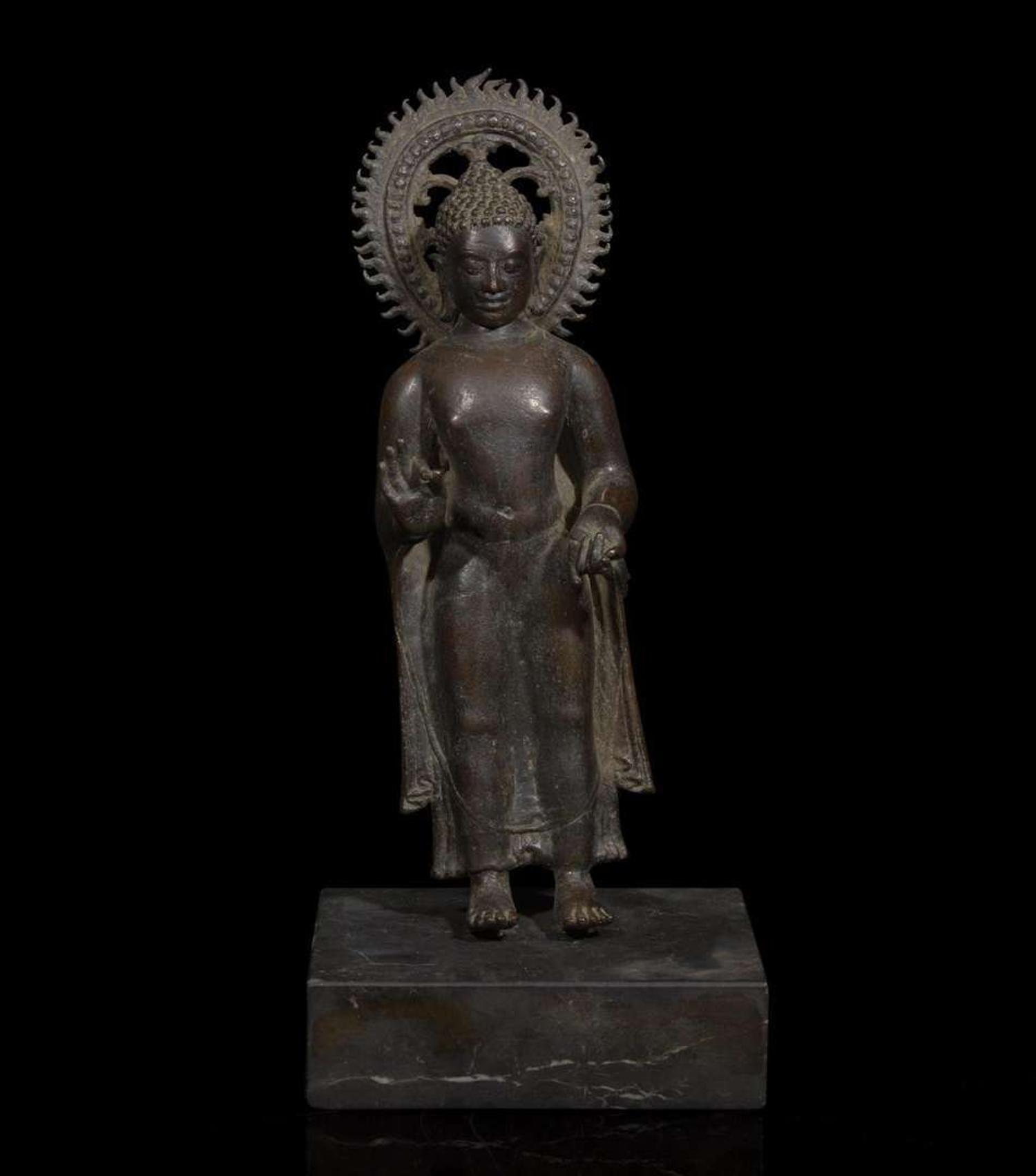 A patinated bronze figure of a standing Buddha 青銅佛造像 9th to 11th Century, possibly Javanese, ??????,?????