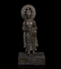 A patinated bronze figure of a standing Buddha 青銅佛造像 9th to 11th Century, possibly Javanese, ??????,?????