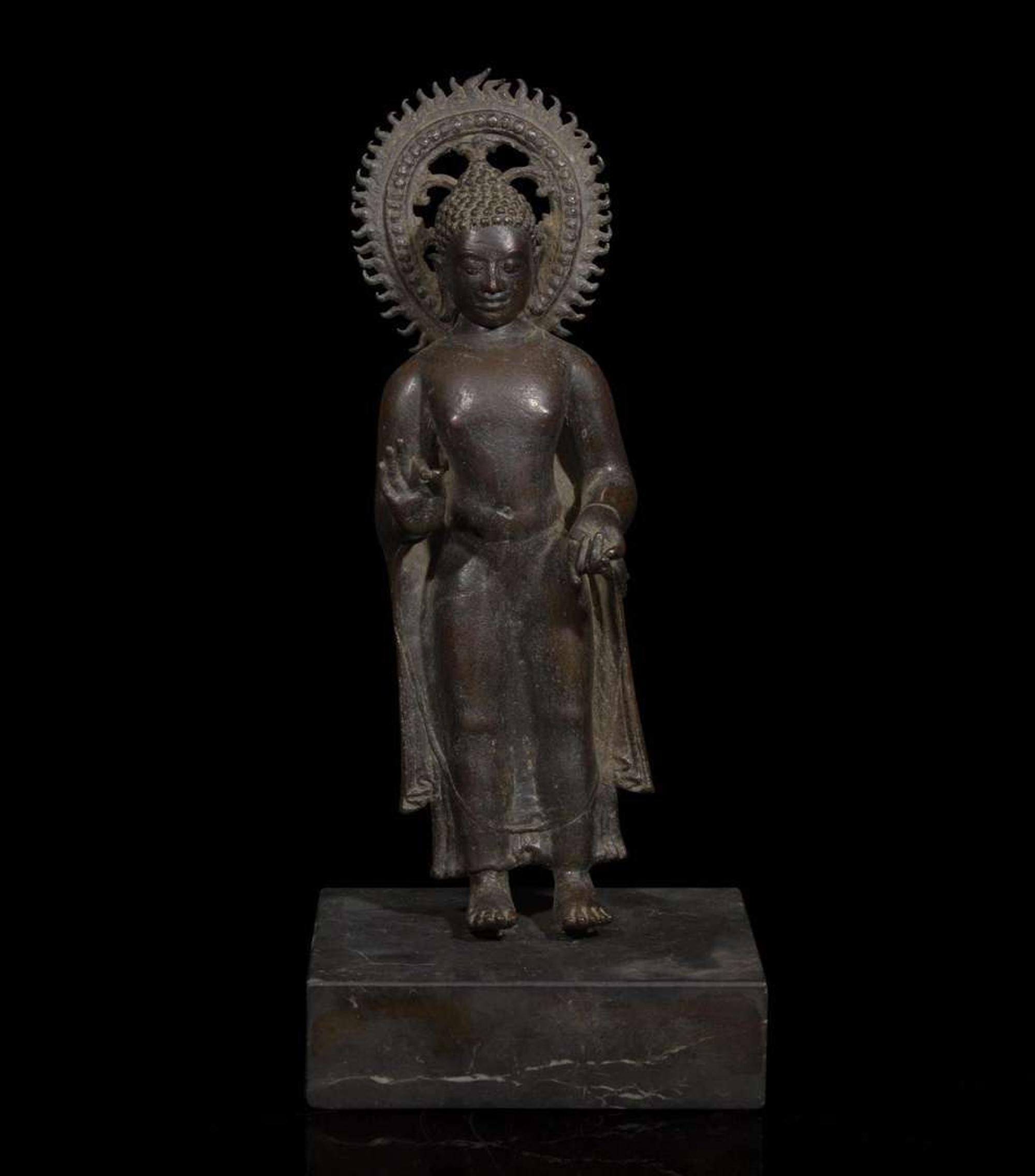 A patinated bronze figure of a standing Buddha 青銅佛造像 9th to 11th Century, possibly Javanese, ??????,?????