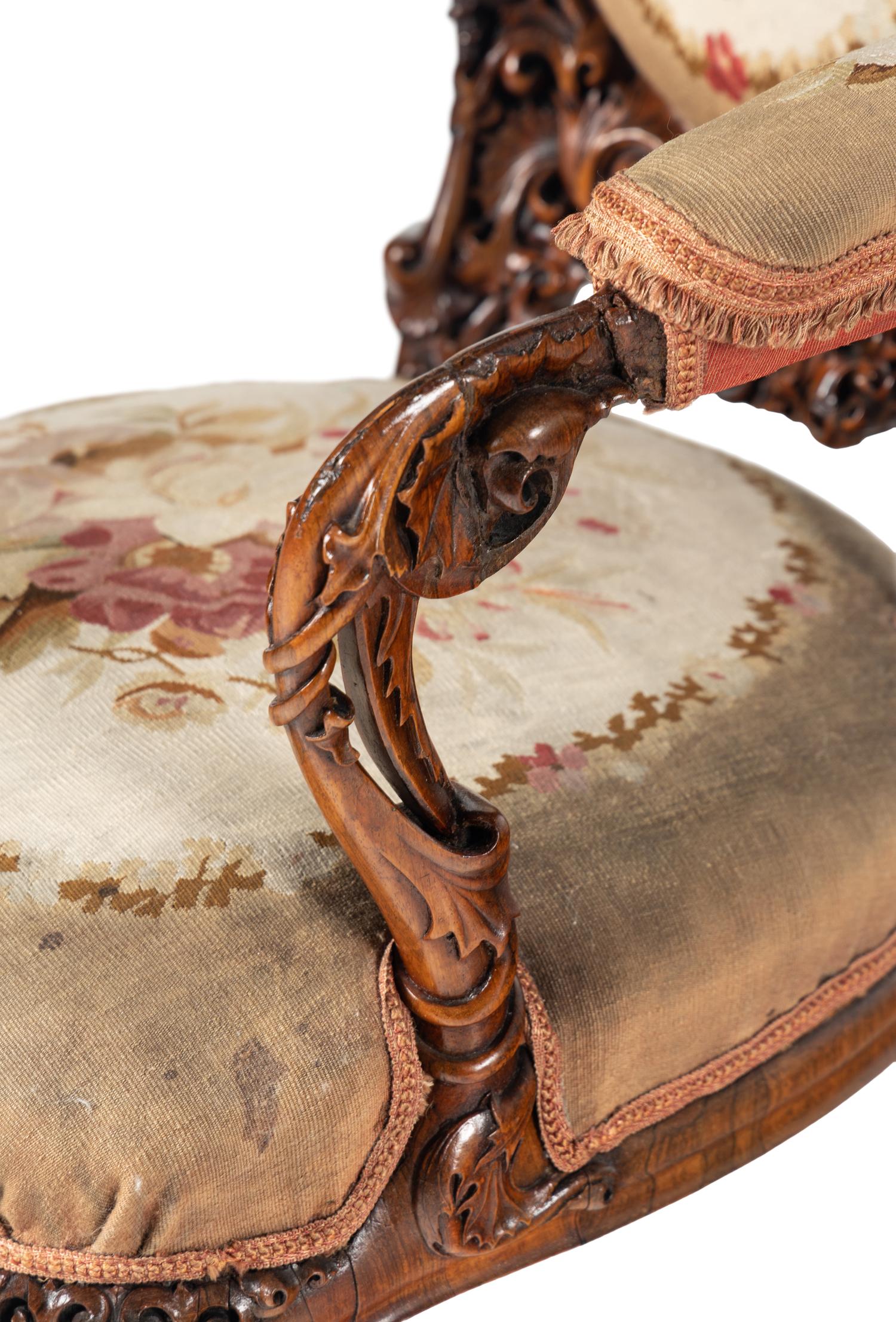 A Pair of Rococo Revival Carved Rosewood Armchairs