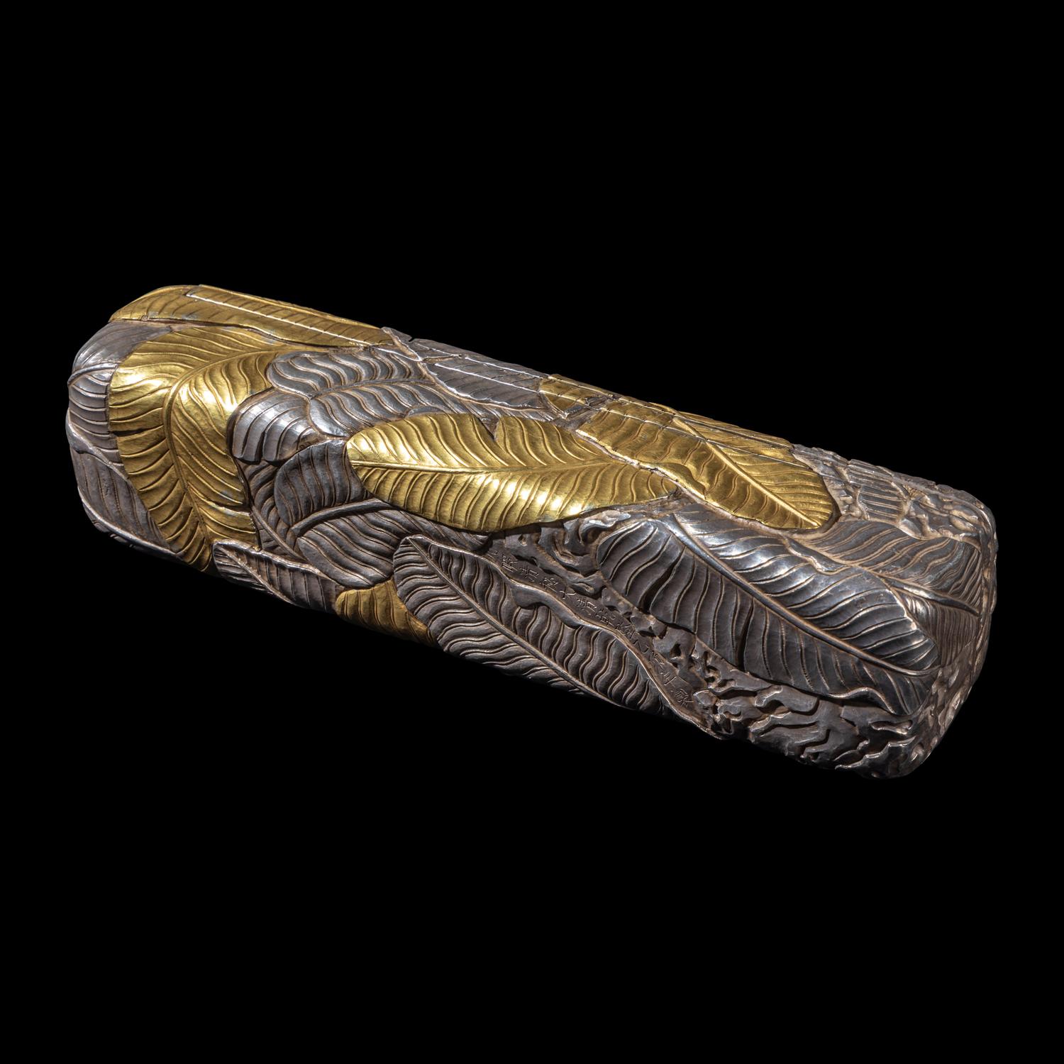 A Chinese Parcel-Gilt Silver Repoussé 'Plantain Leaves' Rectangular Scroll Box, Incised Qianlong Mark 清乾隆乙卯（1796）銀鎏金鏨蕉葉紋手卷機關盒