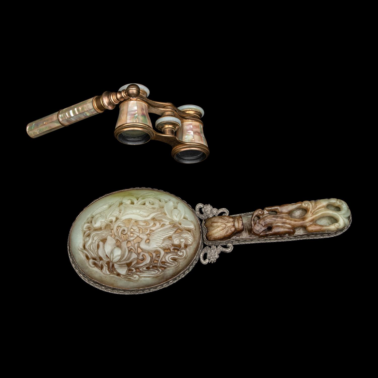 A Chinese White and Russet Jade Inset Hand Mirror and French Mother-of-Pearl Opera Glasses 銅嵌貝母歌劇望遠鏡及銀鑲玉手把鏡