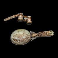 A Chinese White and Russet Jade Inset Hand Mirror and French Mother-of-Pearl Opera Glasses 銅嵌貝母歌劇望遠鏡及銀鑲玉手把鏡