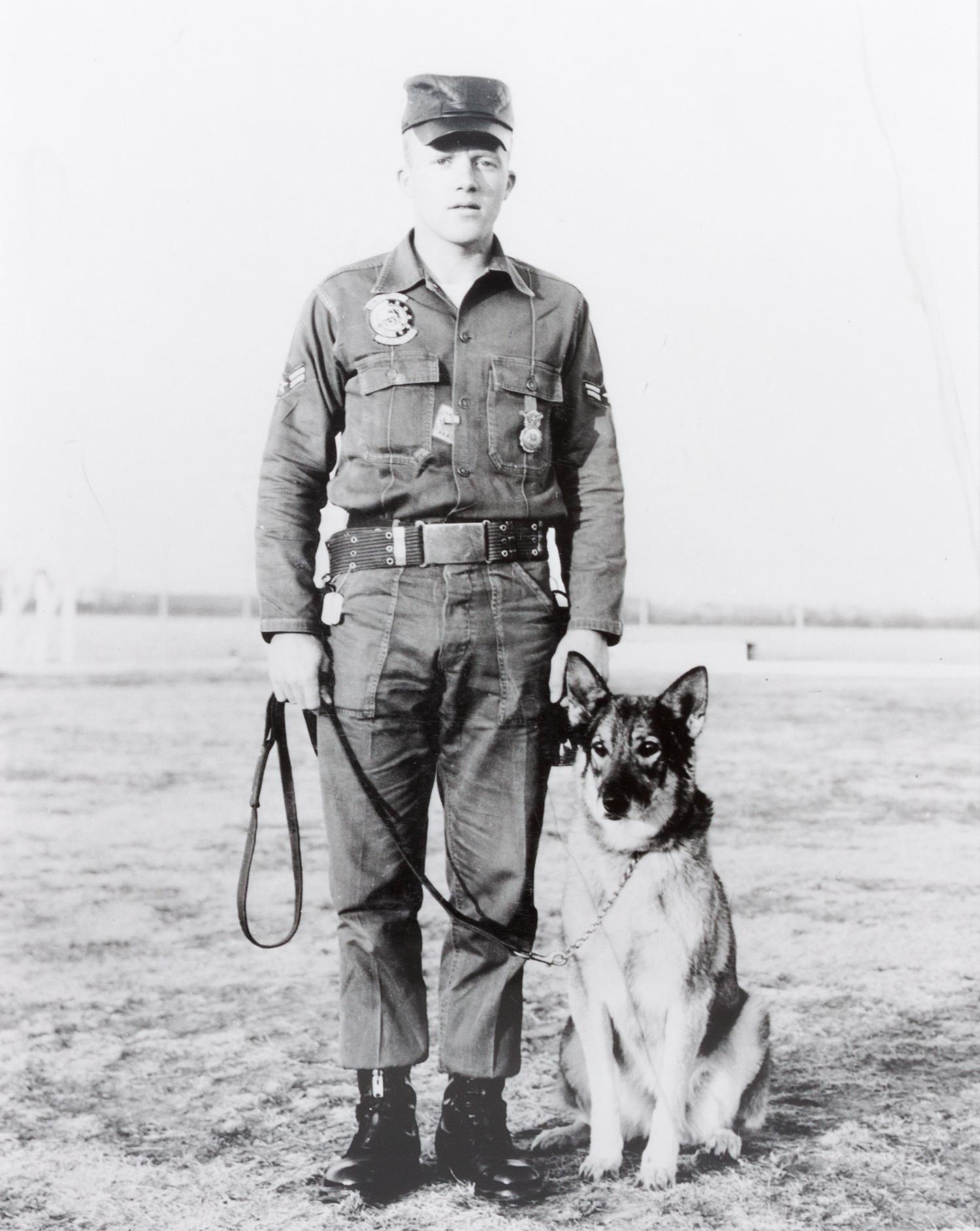 Fourteen Photographs of Military and Police Dogs, Various Breeds Largest: 16 x 12 inches.