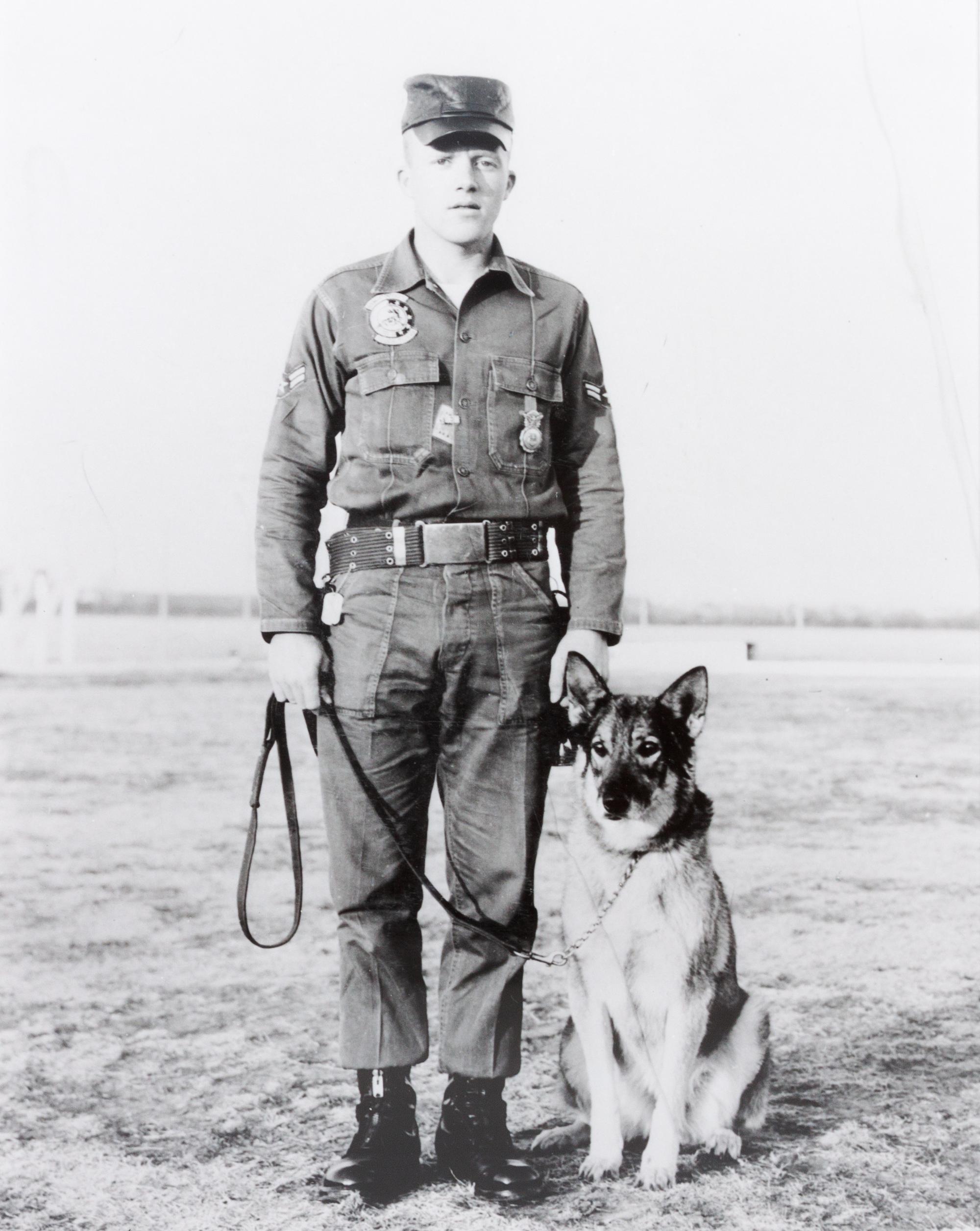 Fourteen Photographs of Military and Police Dogs, Various Breeds Largest: 16 x 12 inches.