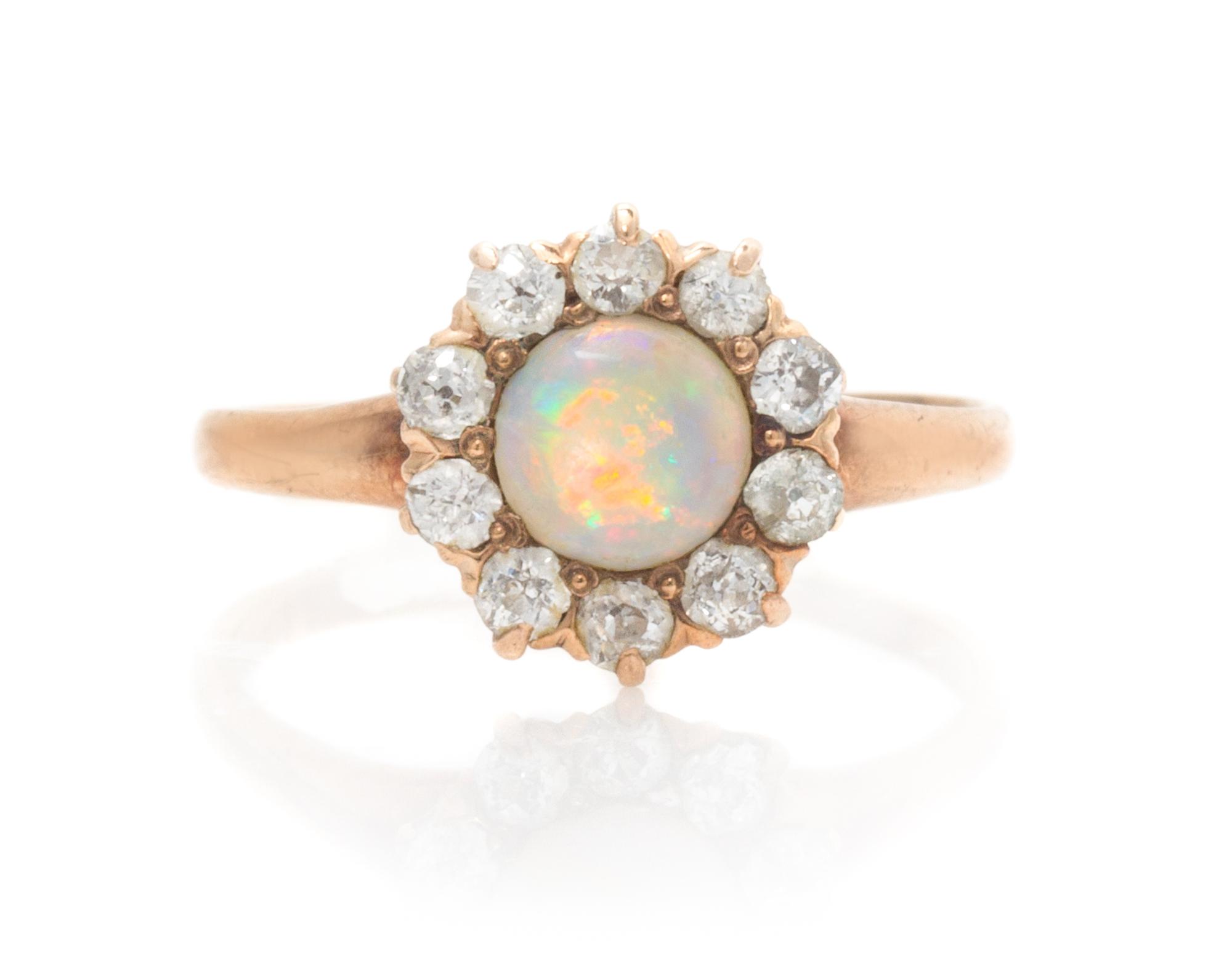 A Victorian Rose Gold, Opal and Diamond Ring, 1.20 dwts.