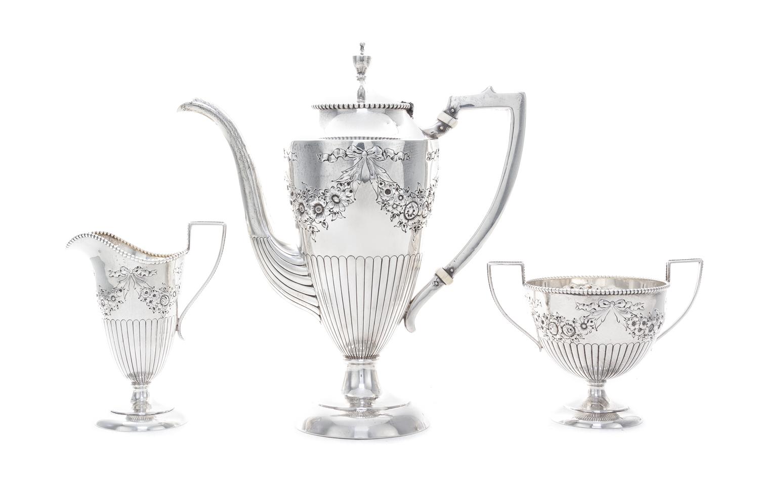 An American Silver Three-Piece Demitasse Set, Lebkuecher & Co., Newark, NJ, Circa 1900, comprising a teapot, creamer and sugar bowl, al