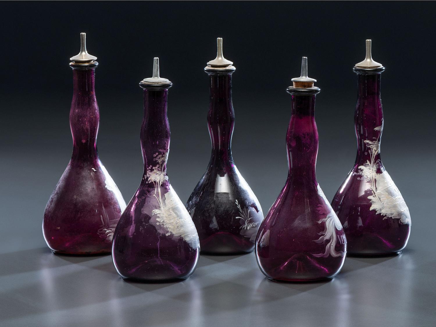 Five 'Mary Gregory' Enameled Amethyst Barber Bottles