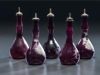 Five 'Mary Gregory' Enameled Amethyst Barber Bottles