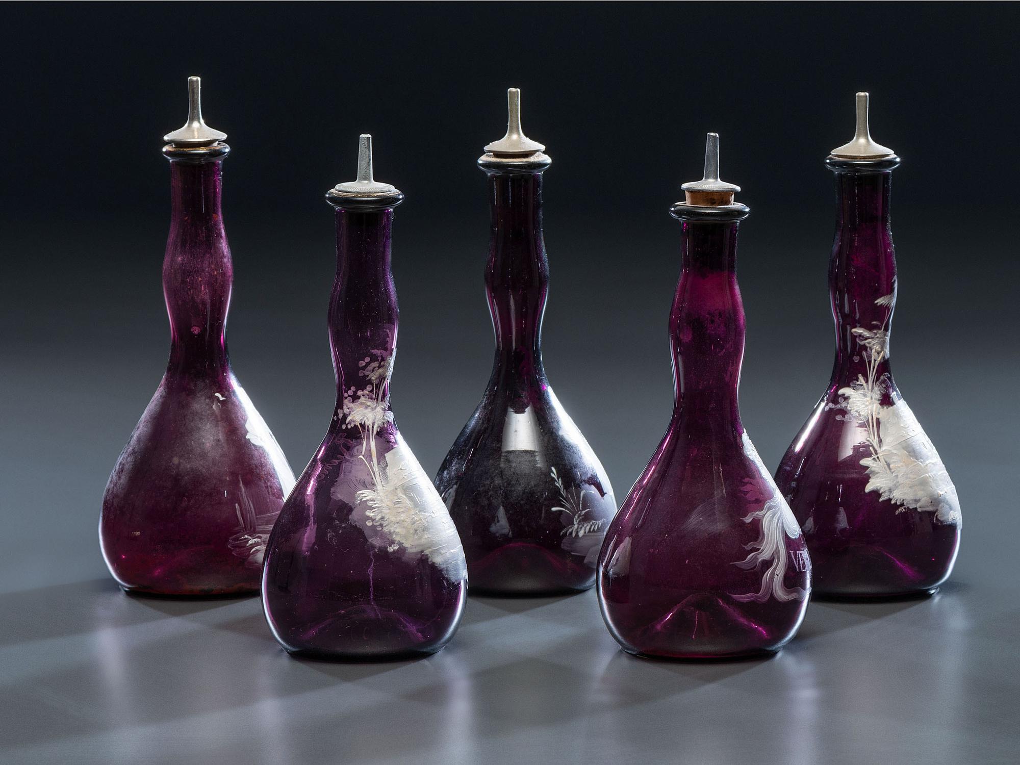 Five 'Mary Gregory' Enameled Amethyst Barber Bottles