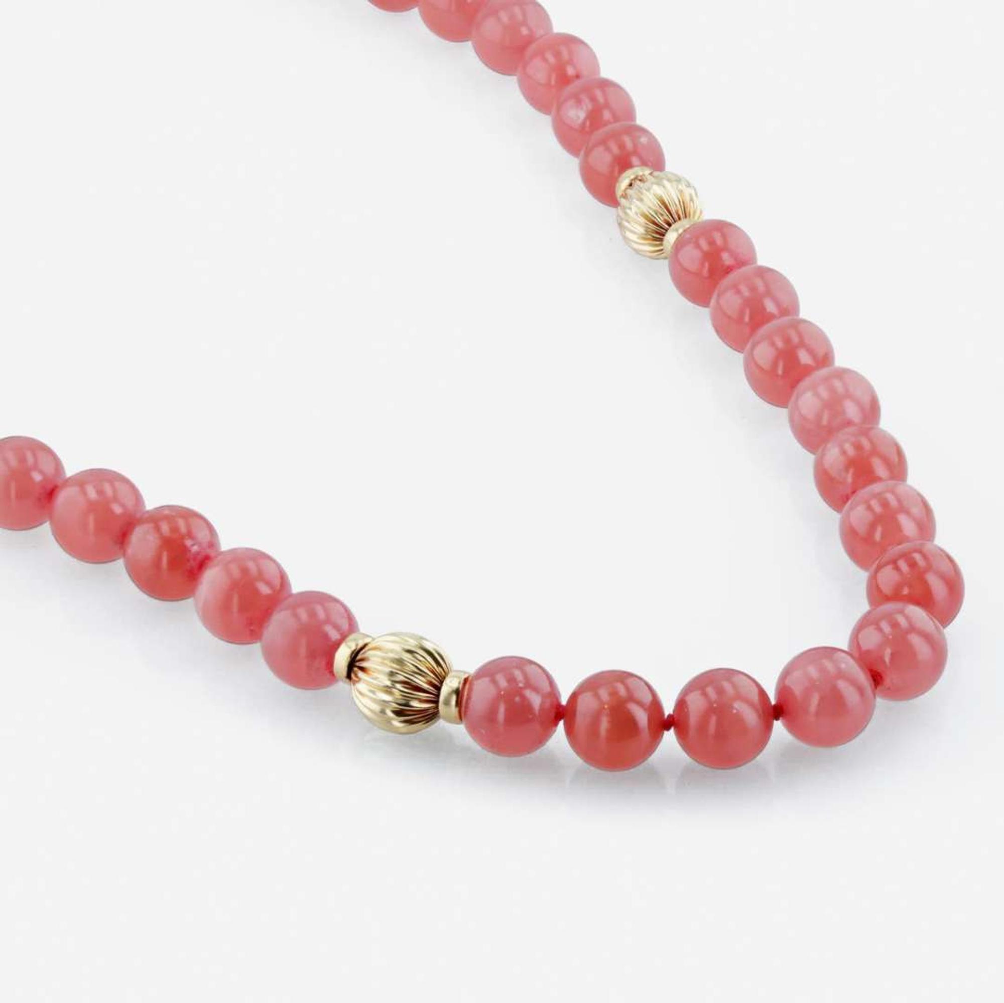 A rhodochrosite and 18K yellow gold bead necklace with citrine and gold brooch