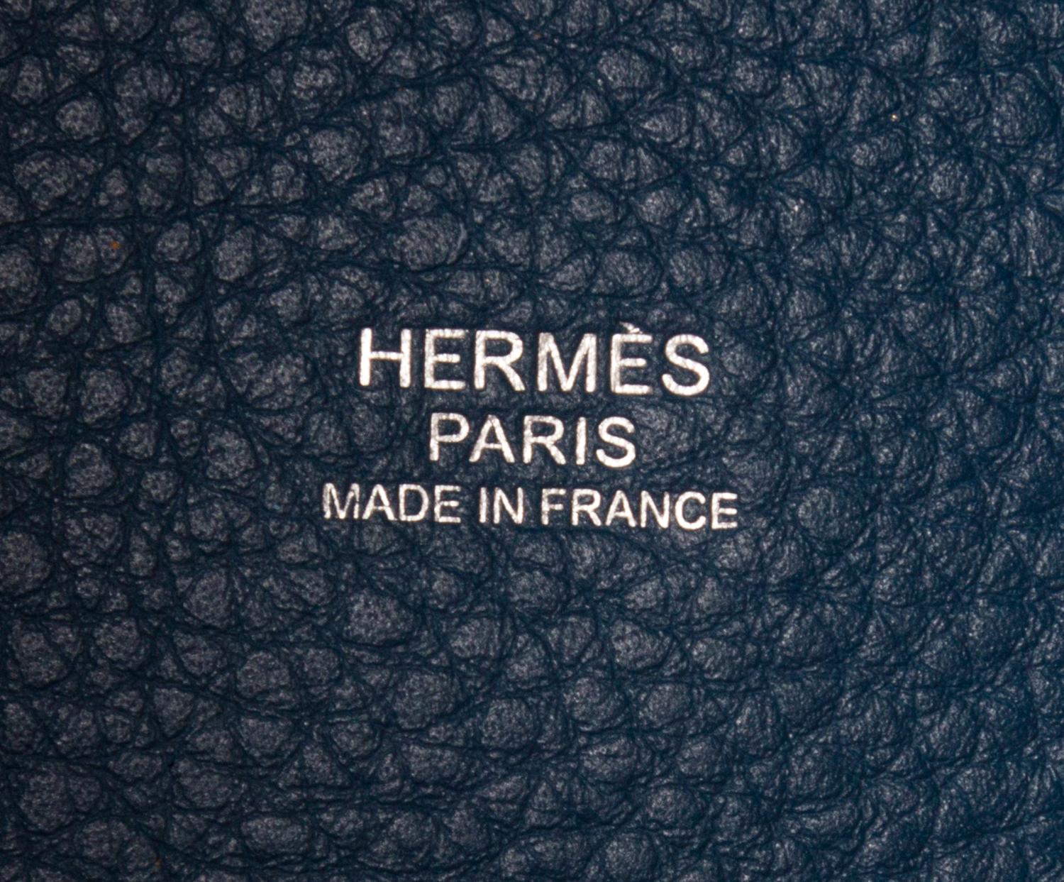 An Hermes Rouge Casaque and Bleu Taurillon Clemence Picotin Lock GM Handbag, 10.5" x 10.5" x 8.5".