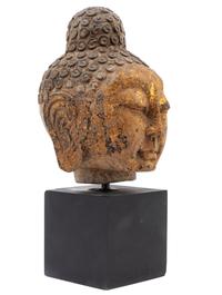 A Chinese Gilt Decorated Stone Head