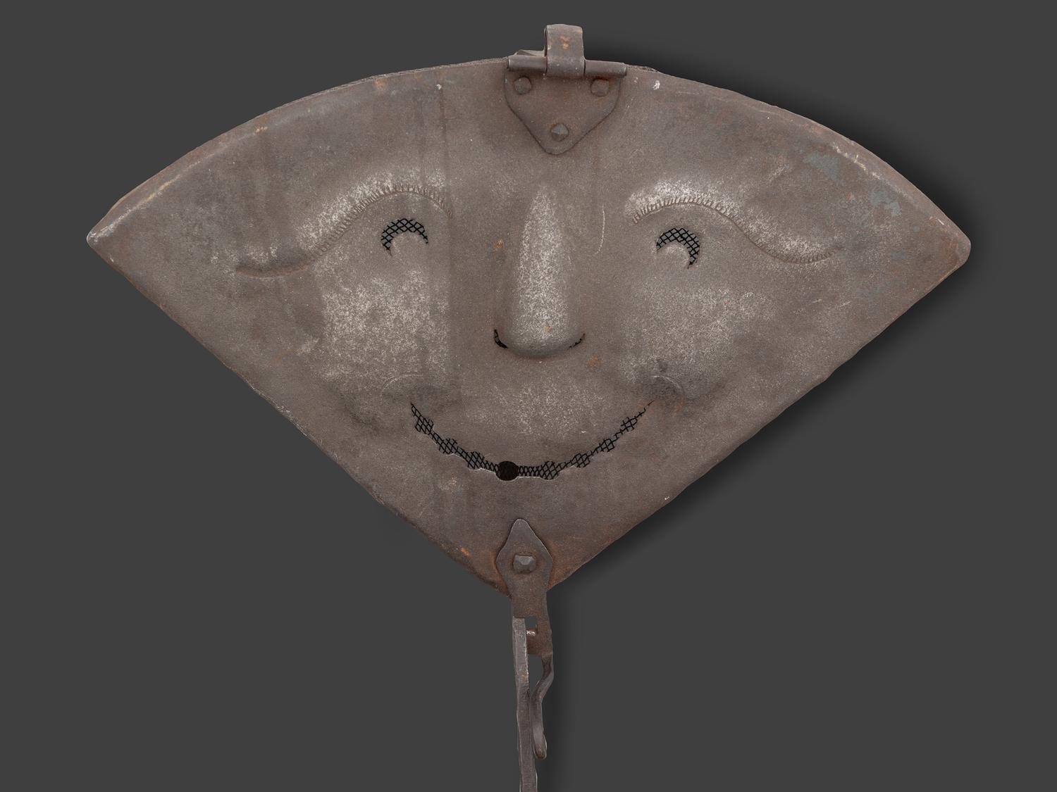 A Forged and Hammered Iron Figural Chestnut Roaster