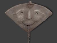 A Forged and Hammered Iron Figural Chestnut Roaster