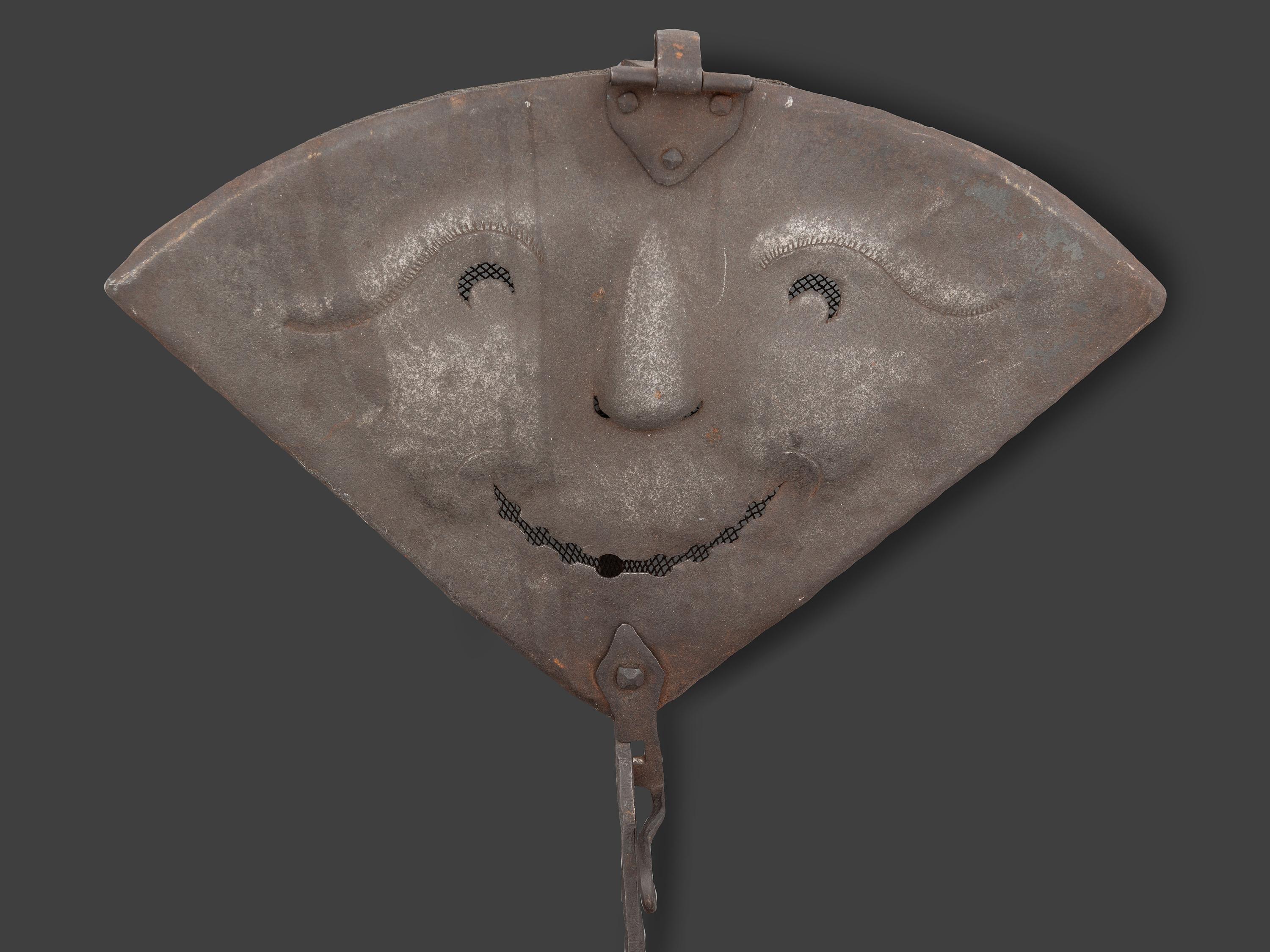 A Forged and Hammered Iron Figural Chestnut Roaster