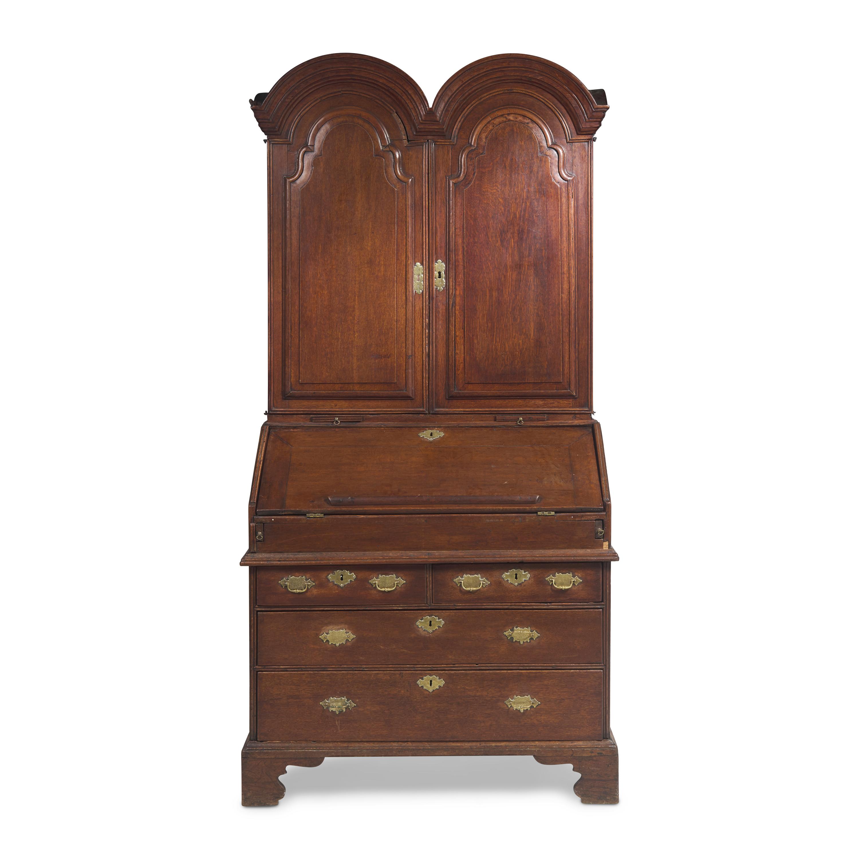 A Queen Anne Carved Oak Double-Dome Top Desk and Bookcase