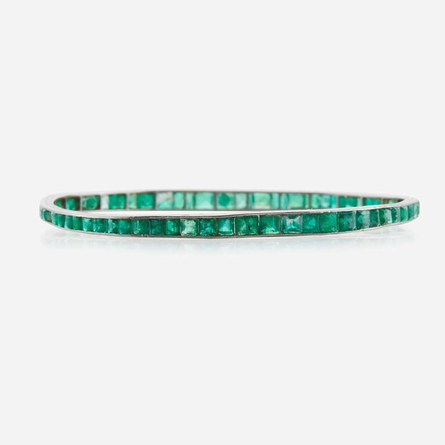 An emerald and platinum bangle