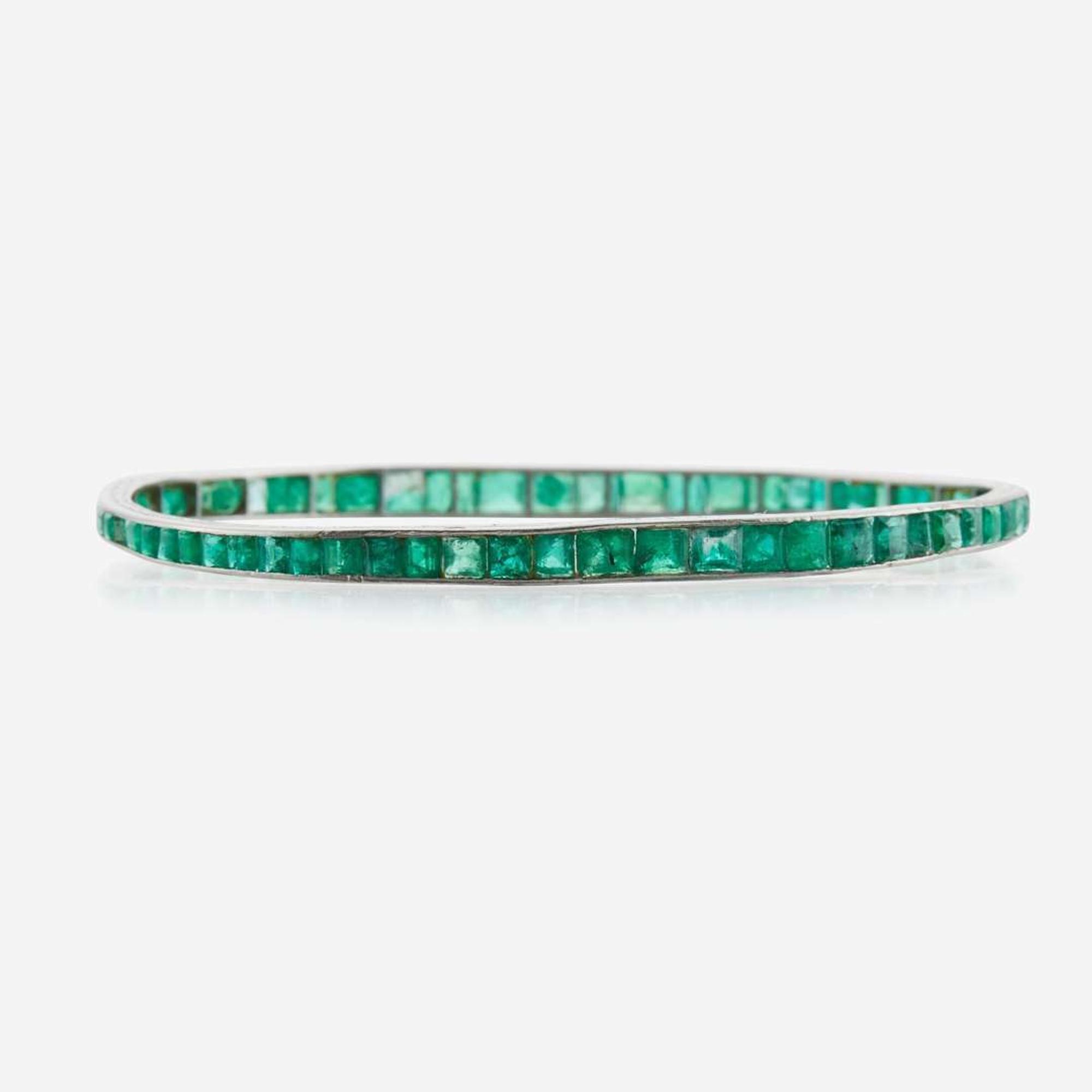An emerald and platinum bangle