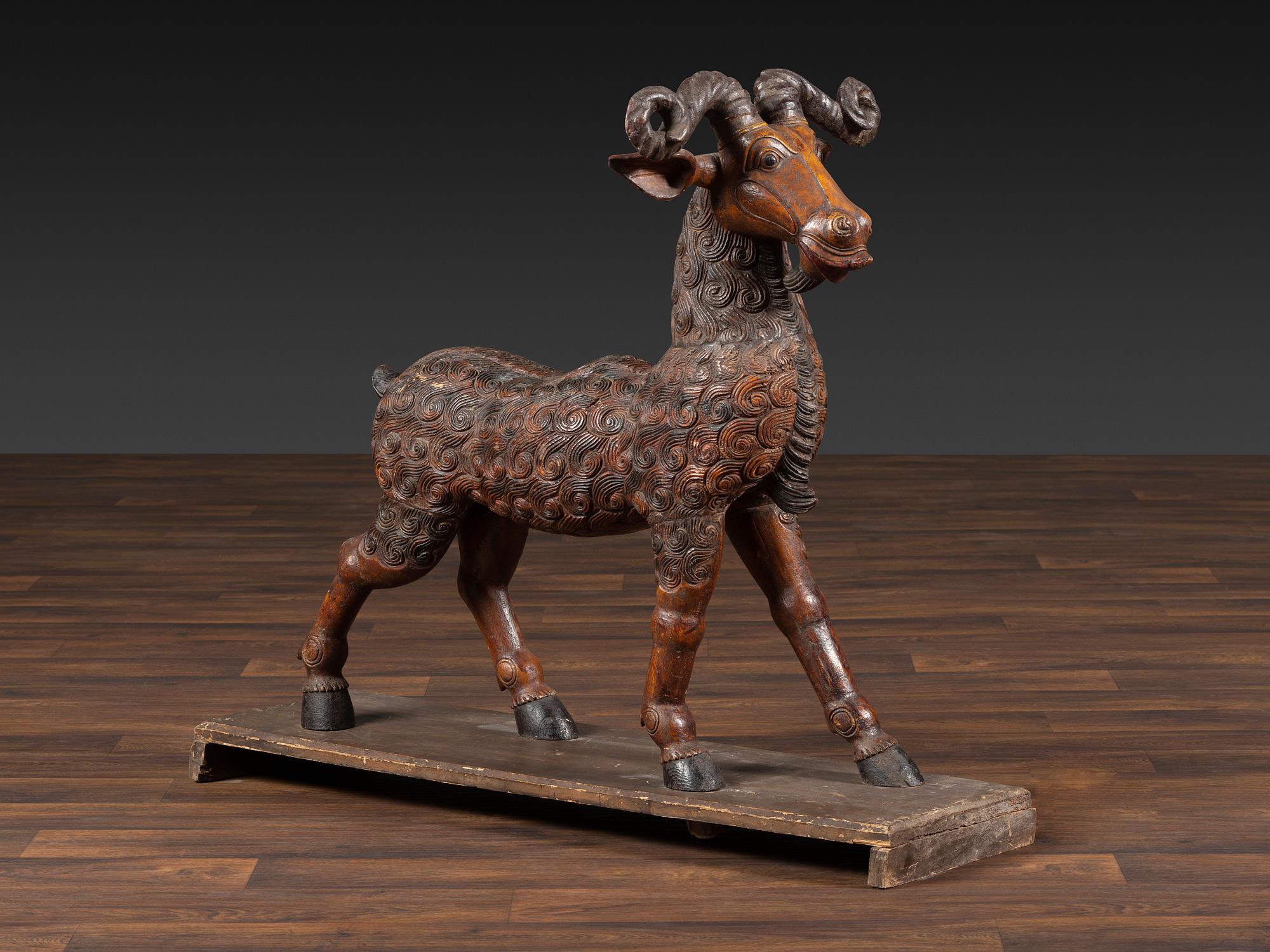 A Folk Art Carved and Painted Wood Ram
