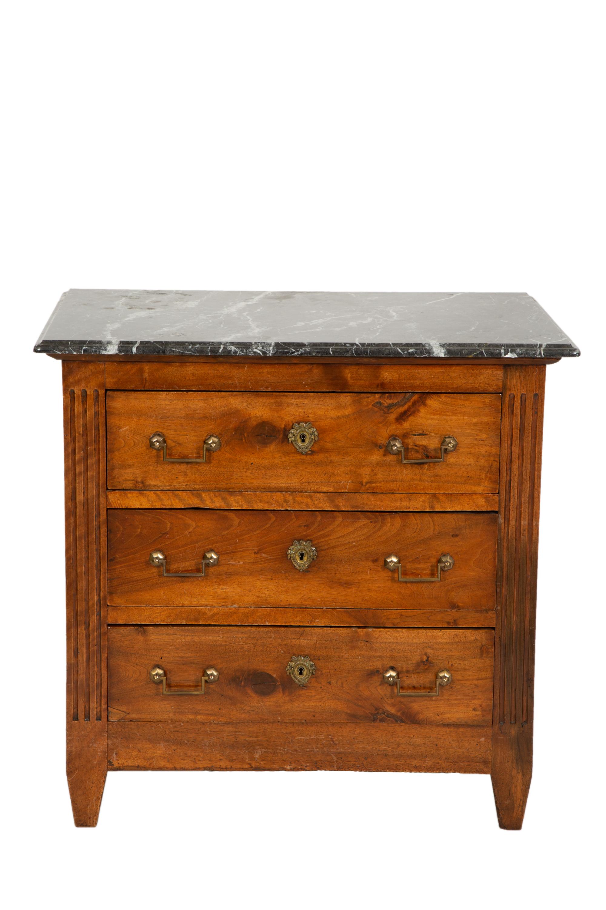 A German Walnut Four-Drawer Commode with Marble Top