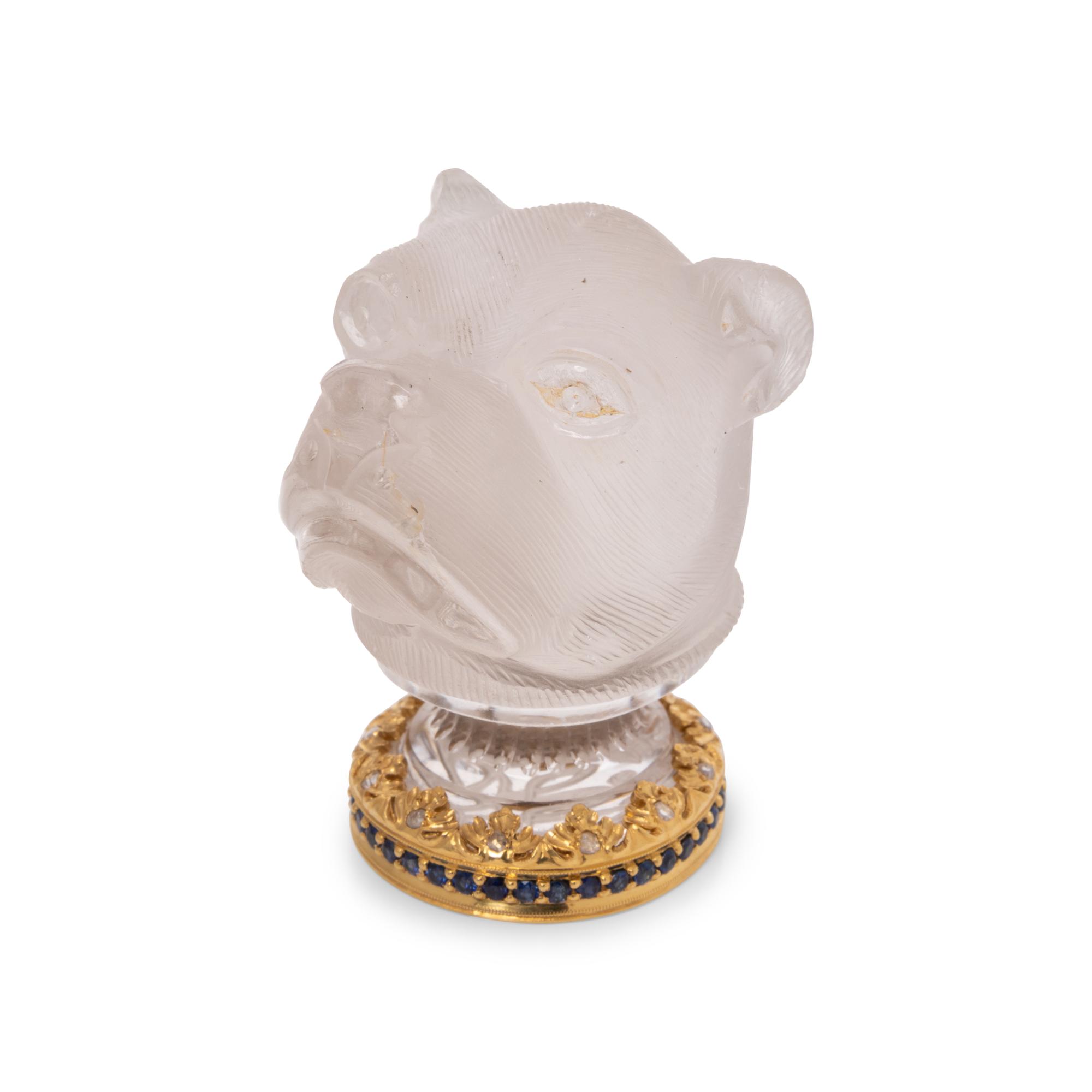 A Continental Gold, Diamond and Sapphire Mounted Carved Rock Crystal Hand-Seal
