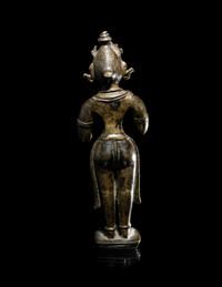 An Indian Bronze Figure of a Standing Female Attendant