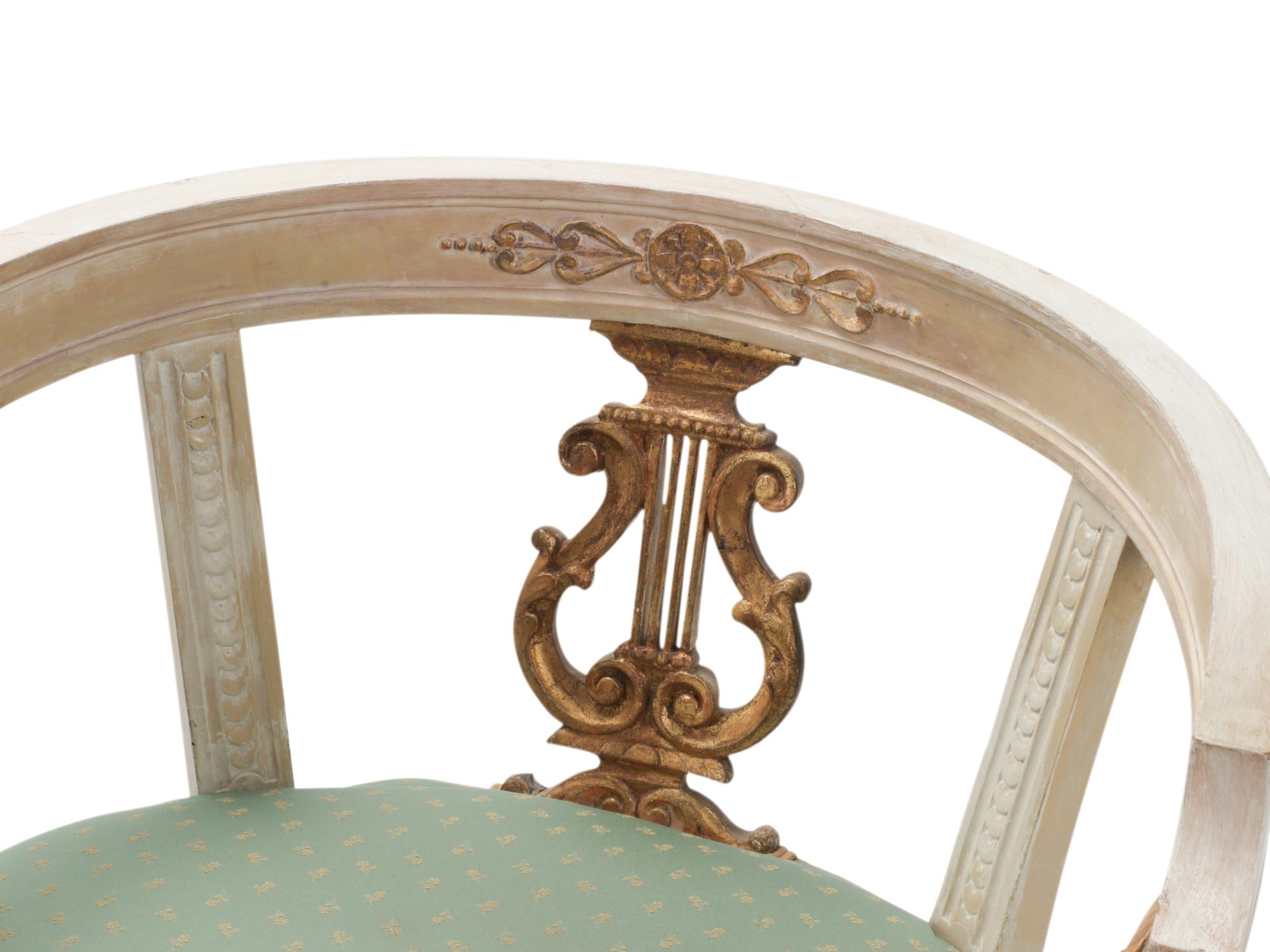 A Pair of Italian Neoclassical Style Painted and Parcel-Gilt Armchairs